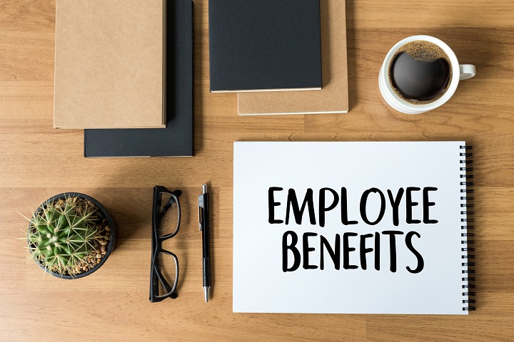 Employee benefits notebook on desk