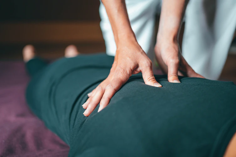 Person receiving a back massage